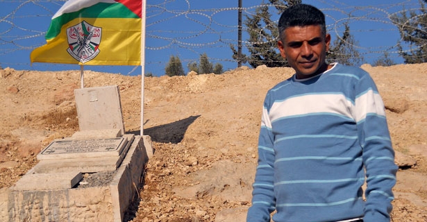 Bilin leader with bassem grave