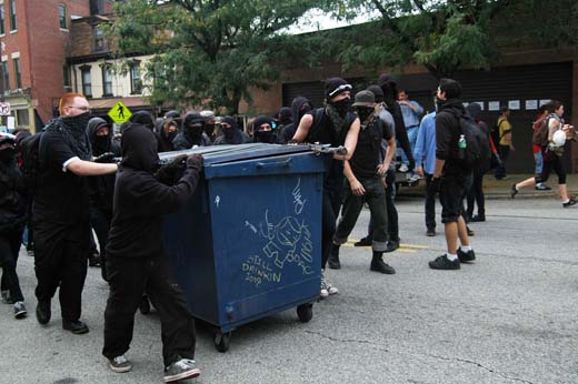 Protesters with dumpster