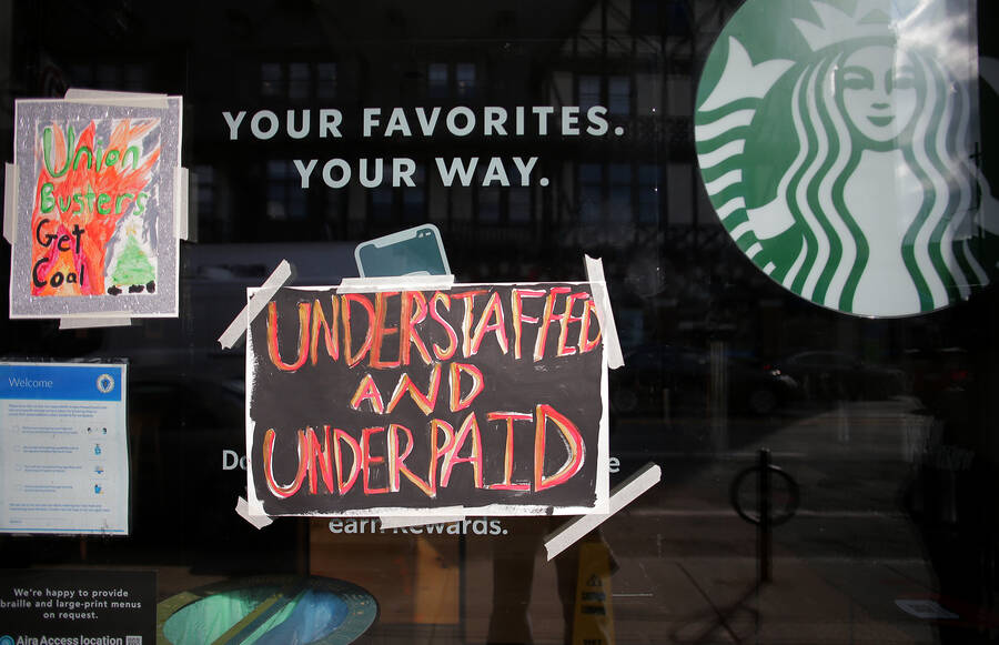 Workers taped signs to the windows of a closed Starbucks location on the chains annual Red Cup Day.
