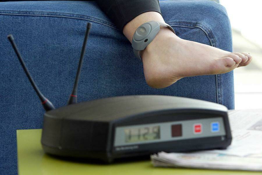 Parolee Being Fitted With Ankle Bracelet Aka Electronic Monitoring Stock Photo Alamy